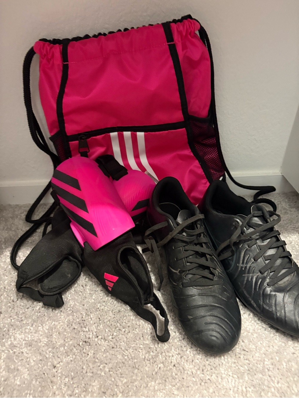 Nike Black Athletic Soccer Cleats with Pink Accessories